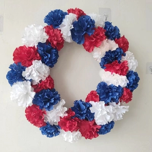 Patriotic USA Independence Day wreath with red white and blue artificial carnations