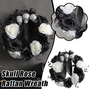 Halloween wreath with black and white roses, three skulls, and gothic ribbon on dark vine