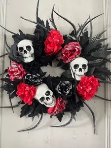 Macro detail of Halloween wreath with black roses and realistic white skull heads