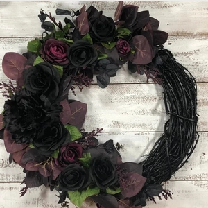 Gothic Halloween wreath with black and purple velvet roses on dark natural branch base