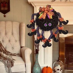 Halloween spider wreath with purple striped legs and witch boots for home door decor