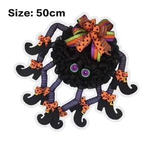 Close-up of 50cm Halloween spider wreath with purple striped legs and orange polka dot bows