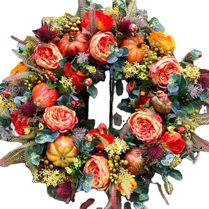 Autumn wreath with pumpkins, peonies and berries on white background for door decor