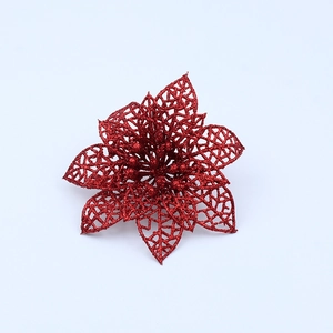 Close-up of red glitter poinsettia flower with hollow mesh petals for Christmas decor