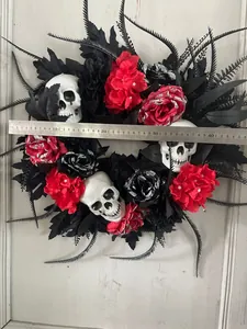 Detailed Halloween wreath with skulls and faux roses, size measurement showing 45cm diameter