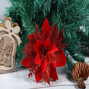 Close-up of red velvet poinsettia flower with glitter edges and detailed stamens