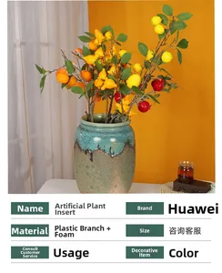 Detail of artificial lemon, citrus and berry stems in a cracked glaze ceramic vase