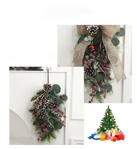 Detail view of festive Christmas swag featuring pine cones, red berries and burlap bow