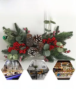 Detailed Christmas pine swag with red berries and snow-tipped cones for wall decoration