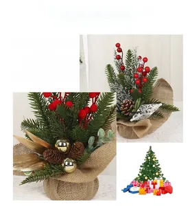 Detail of Christmas desktop centerpiece with pine needles, red berries and burlap base
