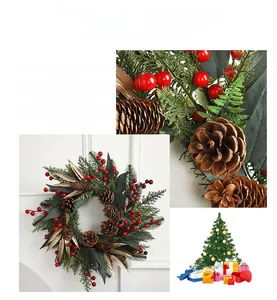 Detail view of a Christmas wreath with green pine branches, red berries, and pinecones
