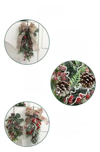 Close-up detail of Christmas swag with pine needles, red berries and burlap bow