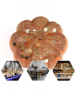 Detailed view of an orange glitter pumpkin with sequins and beads for Halloween decor