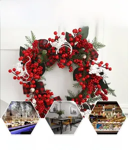 Detailed view of Christmas berry wreath with red and white berries and festive plaid bow