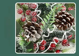 Detail of frosted artificial Christmas teardrop swag with red berries and snowy pine cones