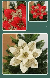 Detail of red and cream artificial Christmas flowers with gold glitter and pine needles