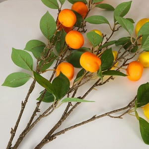 Vibrant artificial orange and lemon branches for DIY festive home decoration and floral design