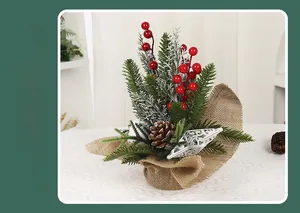Detail of Christmas table decoration featuring red berries, pine cones, and burlap base