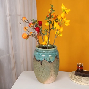 Chinese retro glazed ceramic vase with artificial persimmon and pomegranate branches