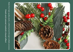 Detail of handmade Christmas wreath with pine cones, red berries and golden leaves