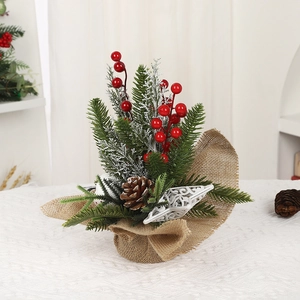 Mini Christmas tabletop tree with cedar needles, red berries and burlap base decoration