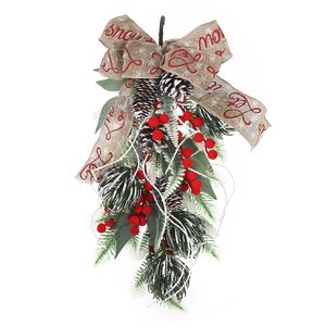 Christmas teardrop swag with red berries and pine needles for holiday wall decoration
