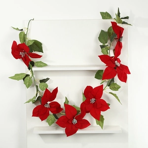 Artificial Christmas poinsettia garland with red silk flowers and green leaves for decor