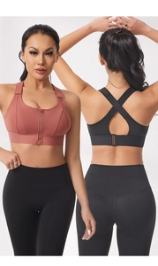 Detail of high-support sports bra with front zipper and cross-back straps in brick red and black