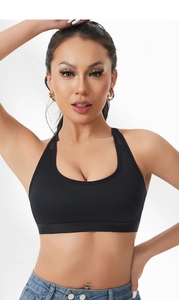 Front view of a breathable black sports bra with mesh fabric and U-shaped neckline