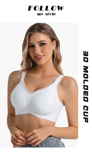 Detail of white seamless bra featuring 3D molded cups and V-neck mesh splicing