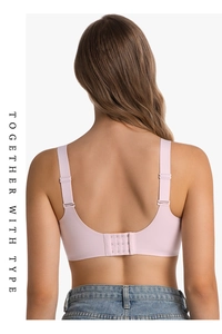Pink seamless bra featuring a U-shaped back design with adjustable wide straps and hooks