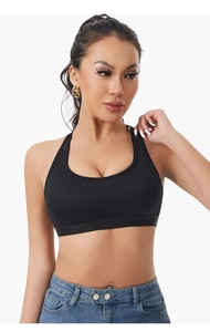 Close-up of black racerback sports bra with mesh texture and elastic band detail