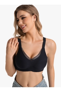 Detail of black seamless V-neck bra featuring breathable mesh panels and wide straps