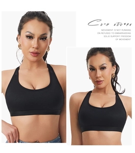 Detail of black cross-strap sports bra featuring breathable mesh fabric and solid support