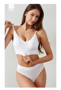 Detail of white seamless ribbed lingerie set with deep V-neck and wavy scalloped edges
