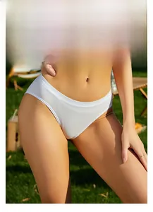 Detail of white ribbed cotton panties featuring seamless texture and elastic waistband