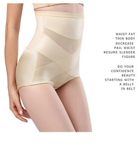 Détail de culotte gainante taille haute avec bande de compression croisée et mesh