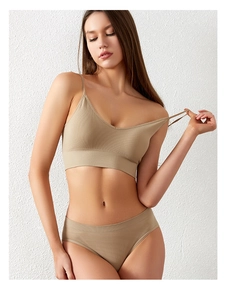 Detailed close-up of ribbed texture and seamless V-neck design on nude lingerie set