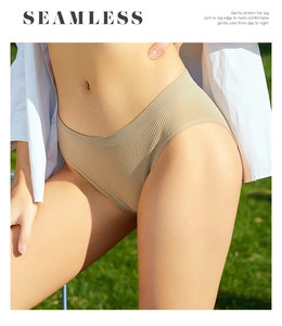 Detail of seamless khaki ribbed cotton panties showing elastic waist and fabric texture