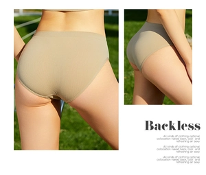 Detail view of khaki seamless ribbed cotton panties on a natural grass background