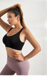 Detail view of high-elastic black sports bra with wide straps and side support panels