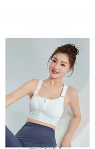 Dettaglio zip frontale su reggiseno sportivo bianco ad alto impatto con spalline