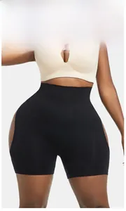 High-waisted black shaping shorts featuring seamless knitting and breathable mesh details