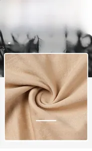 Macro detail of breathable nude knitted fabric showing smooth texture and raw materials