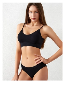 Front view of black ribbed seamless bra and panty set showing detailed fabric texture