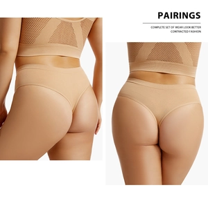 Detail of seamless breathable mesh sports bra and thong set in apricot color