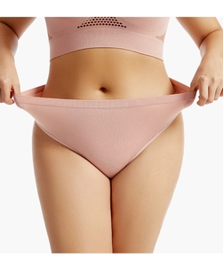 Detail of high-stretch ribbed knit seamless thong and sports vest in dusty rose pink