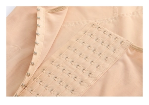 Detail of adjustable hook-and-eye closure on breathable mesh waist trainer vest