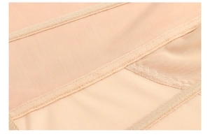 Detailed macro view of breathable beige mesh fabric and reinforced stitching on shapewear