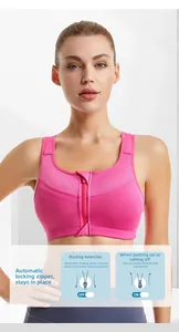 Front zipper detail on rose pink sports bra showing the auto-lock security feature